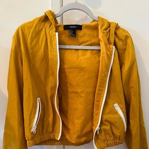 Yellow jacket with a white zipper